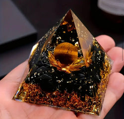 Black obsidian stone pyramid with Tiger’s eye stone ball